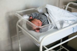 baby lying in hospital room