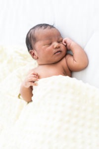 newborn baby sleeping in a blanket