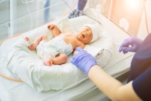 A-nurse-cares-for-a-newborn-baby-in-the-hospital