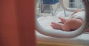 close-up newborn baby in neonatal intensive care unit (NICU). What is Horner syndrome