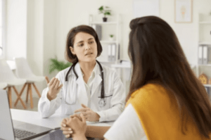 A gynecologist discussing the options for VBAC with a patient.